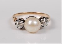 Lot 2699 - A cultured pearl and diamond ring, the central...
