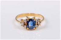 Lot 2704 - An 18ct sapphire and diamond ring, the oval...