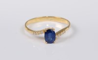 Lot 2707 - A 14ct sapphire and diamond ring, the oval...