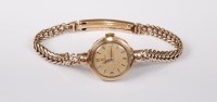 Lot 2725 - A lady's 9ct wristwatch, the round dial with...