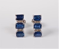 Lot 2727 - A pair of sapphire and diamond earrings, the...
