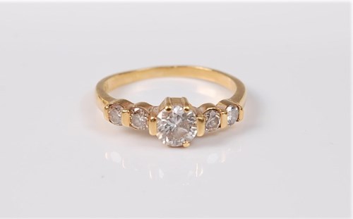 Lot 2730 - A five stone diamond ring, the central round...