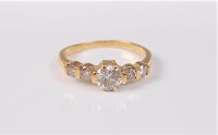 Lot 2730 - A five stone diamond ring, the central round...