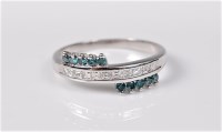 Lot 2732 - A bi-colour diamond ring, the small treated...