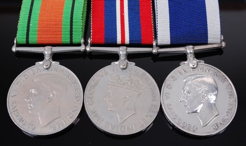 Lot 1009 - A Naval group of three to include WW II...