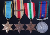 Lot 1047 - A WW II group of four to include Air Crew...