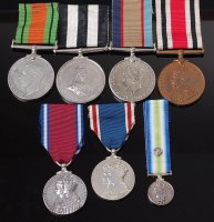 Lot 1051 - A group of seven medals to include WW II...