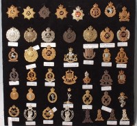 Lot 1092 - A collection of assorted cap badges and...