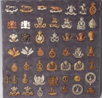 Lot 1093 - A collection of assorted cap badges and...