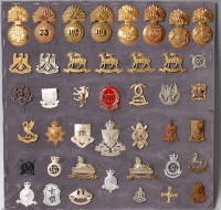 Lot 1095 - A collection of assorted cap badges and...