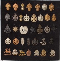 Lot 1099 - A large collection of assorted cap badges and...