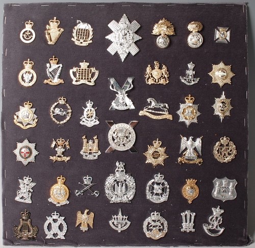 Lot 1104 - A large collection of assorted cap badges and...