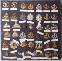 Lot 1105 - A large collection of assorted cap badges and...