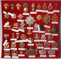 Lot 1107 - A large collection of assorted cap badges and...