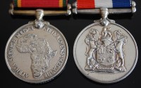 Lot 1129 - An Africa Service medal (1939-45) naming...