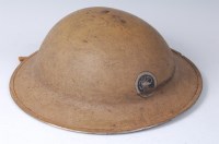 Lot 1195 - WITHDRAWN A British steel helmet sand painted...