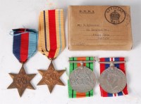 Lot 1228 - A WW II group of four to include 1939-45 Star,...