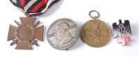 Lot 1258 - A German Cross of Honour with swords, together...