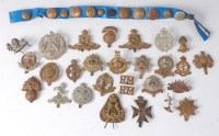 Lot 1267 - A collection of assorted military cap badges...