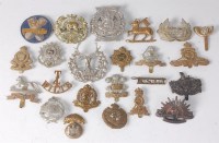 Lot 1271 - A collection of assorted cap badges, cloth...