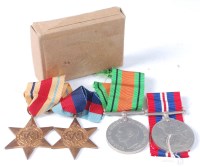 Lot 1300 - A group of four WW II medals to include...