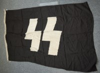 Lot 1325 - A German SS flag on a black field with white...
