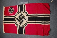 Lot 1327 - A German Kriegsmarine battle flag on a red...