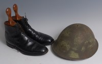 Lot 1375 - A WW II Brodie type steel helmet having a...