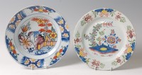 Lot 15 - An 18th century Delft plate, polychrome...