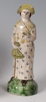 Lot 23 - An 18th century Whieldon pottery figure of a...