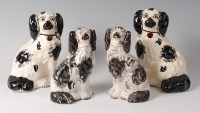 Lot 27 - A pair of Victorian Staffordshire spaniels,...