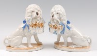 Lot 29 - A pair of German porcelain spaniel figures,...