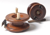 Lot 140 - A 19th century turned fruitwood fly reel,...
