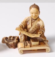 Lot 234 - A Japanese Meiji period carved ivory okimono...