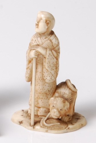 Lot 235 - A Japanese Meiji period carved ivory okimono...