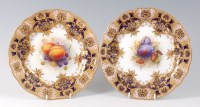 Lot 2067 - A pair of Royal Worcester porcelain cabinet...