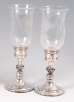 Lot 2112 - A pair of modern silver candle holders, each...