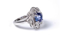 Lot 2128 - A tanzanite and diamond ring, the round mixed...