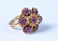 Lot 2138 - An 18ct sapphire and ruby cocktail ring, the...