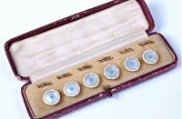 Lot 2140 - A set of six enamel buttons, each button...