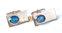 Lot 2141 - A pair of 9ct gold opal set cufflinks, the...