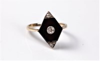 Lot 2144 - An Art Deco onyx and diamond ring, the central...