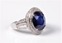 Lot 2145 - A treated sapphire and diamond ring, the oval...