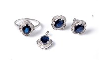 Lot 2153 - A 9ct white gold sapphire and diamond suite,...