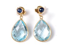 Lot 2154 - A pair of topaz and sapphire earrings, the...