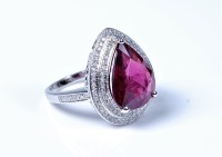 Lot 2159 - A treated ruby and diamond ring, pear shaped...