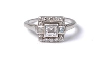 Lot 2167 - An Art Deco diamond ring, the central princess...