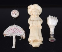 Lot 2233 - A small group of ivory and bone items, to...