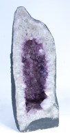 Lot 2257 - A large amethyst geode, slice-cut and with...