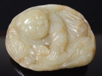 Lot 2264 - A circa 1900 Chinese green jade oval figural...